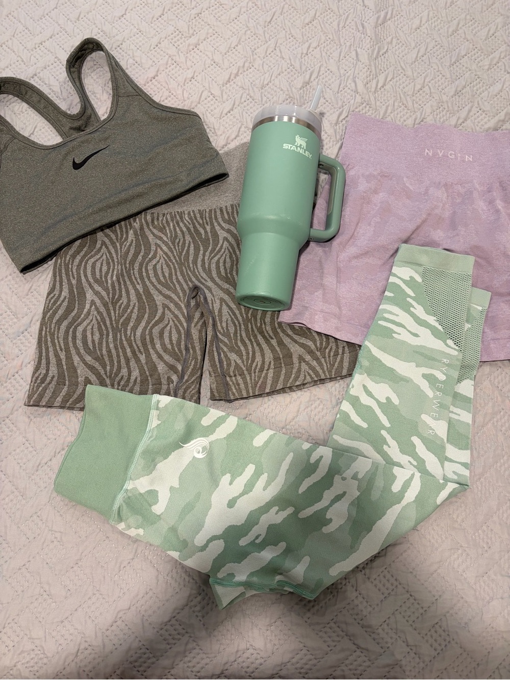Stanley Mint Green Insulated Tumbler with bundle of clothes